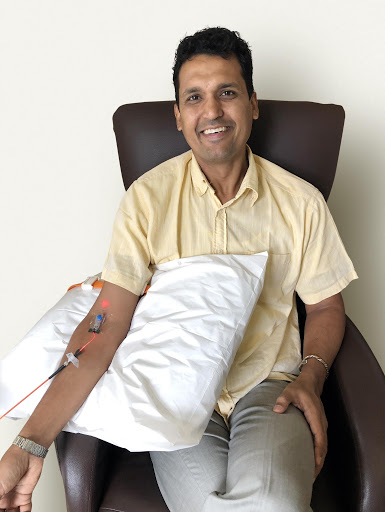 Man receiving IV vitamin therapy